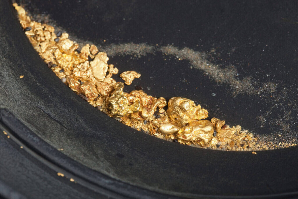 panning for gold uncovers nuggets and flakes
