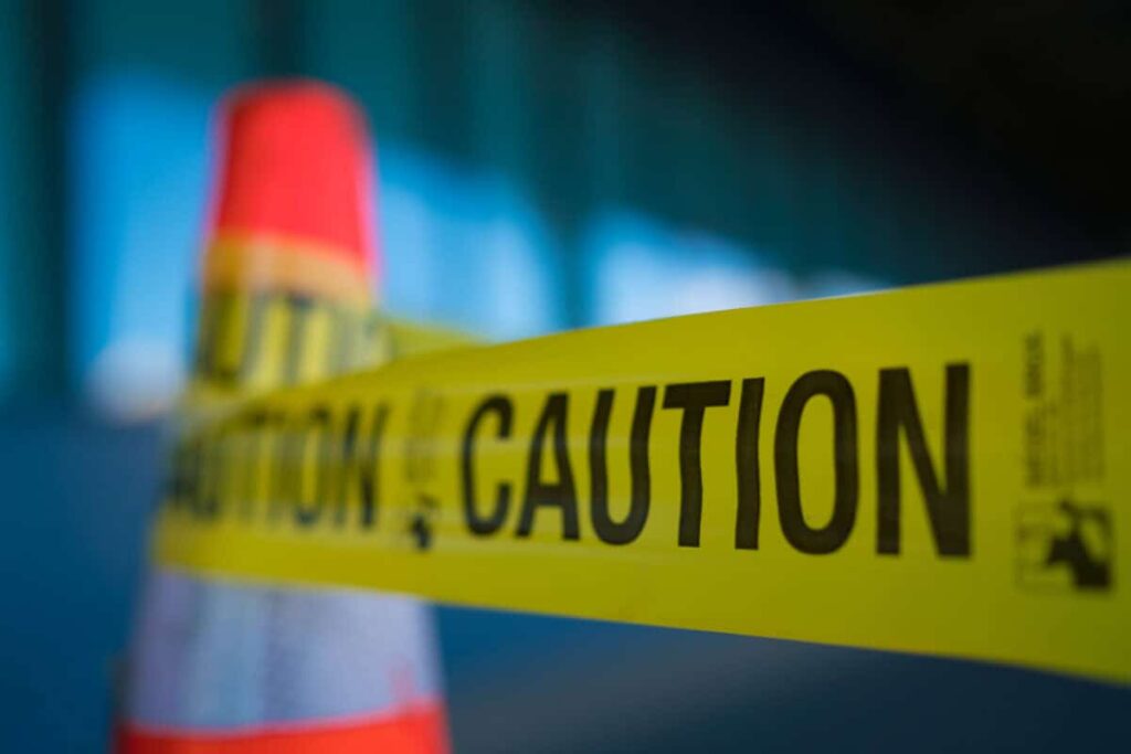 Your RRSP Could Become a Tax Problem Before You Realize You’re Wealthy Yellow caution tape attached to traffic cone