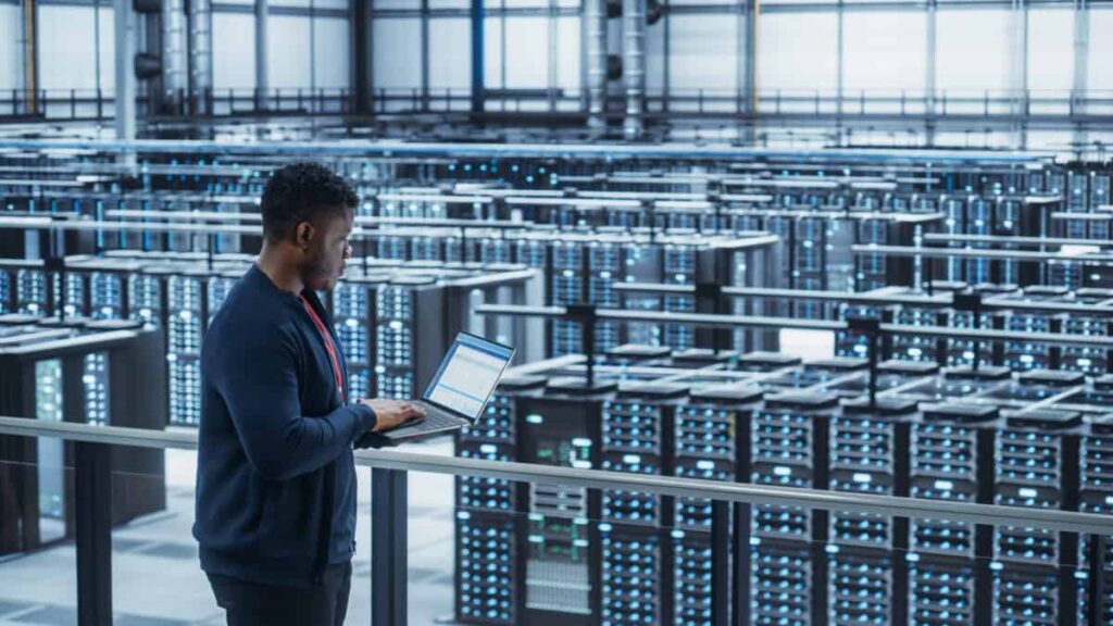 Hammond Power Solutions Is Positioned for the Big Data Centre Buildout: Here’s How I’d Buy It Data Center Engineer Using Laptop Computer crypto mining